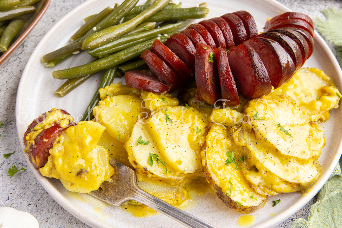 Cheesy Potatoes with Hasselback Smoked Sausage